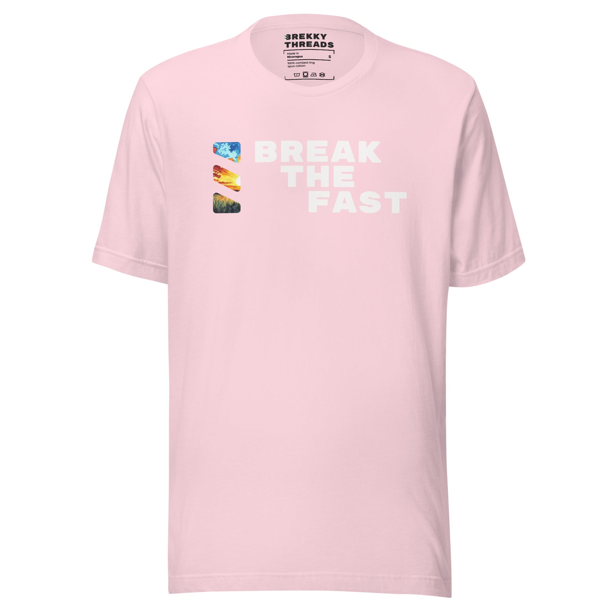 Graphic Tshirt with the comedic saying "Break The Fast" printed on the front with a diagonal stance, going from the top left to the bottom right. The Brekky Threads logo is printed vertically to the left of the text, masking an image of a sunrise. Staple tshirt, comfortable slim fit. Printed label with Company logo inside the colar. Unisex. Color: Soft Pink.