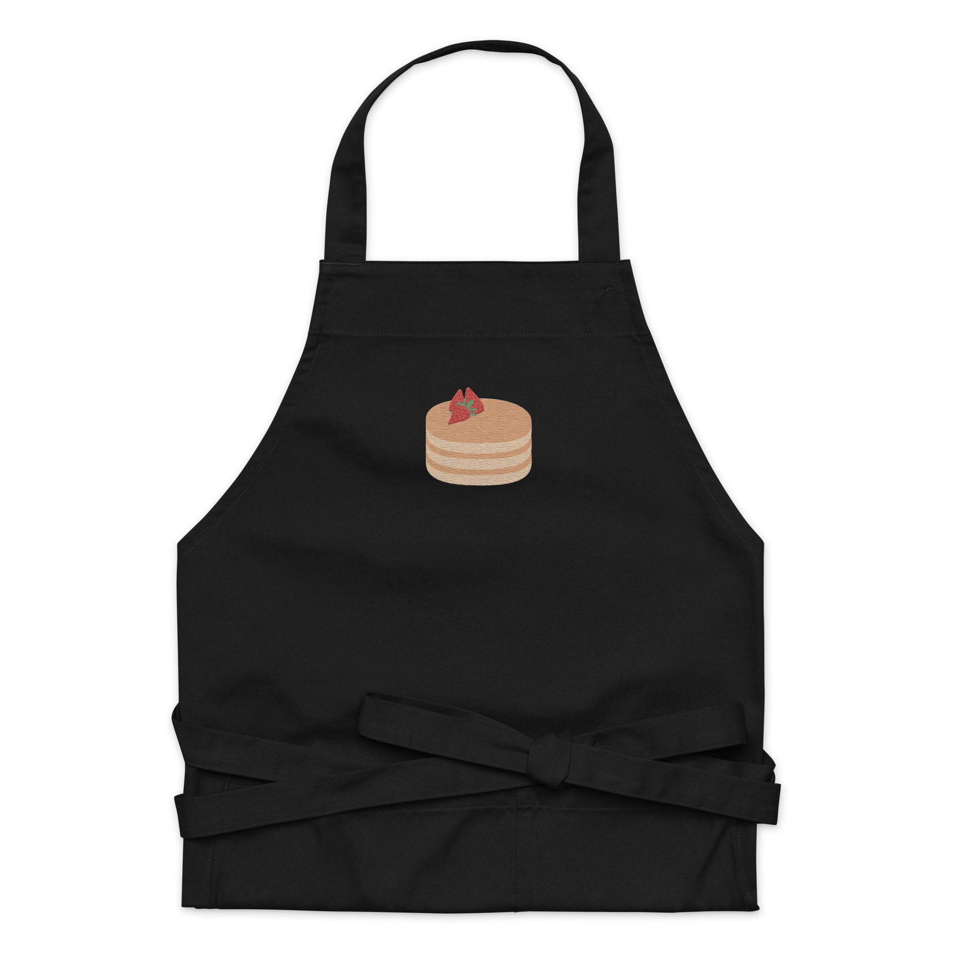 Kitchen apron embroidered on the front. The design is of pancakes with 3 strawberries on top, in a graphic are / vector art style. Apron features 2 front pockets and long straps to be tied behind the wearer in the usual manner. Unisex. One Size. Color: Black. Designed by Brekky Threads.