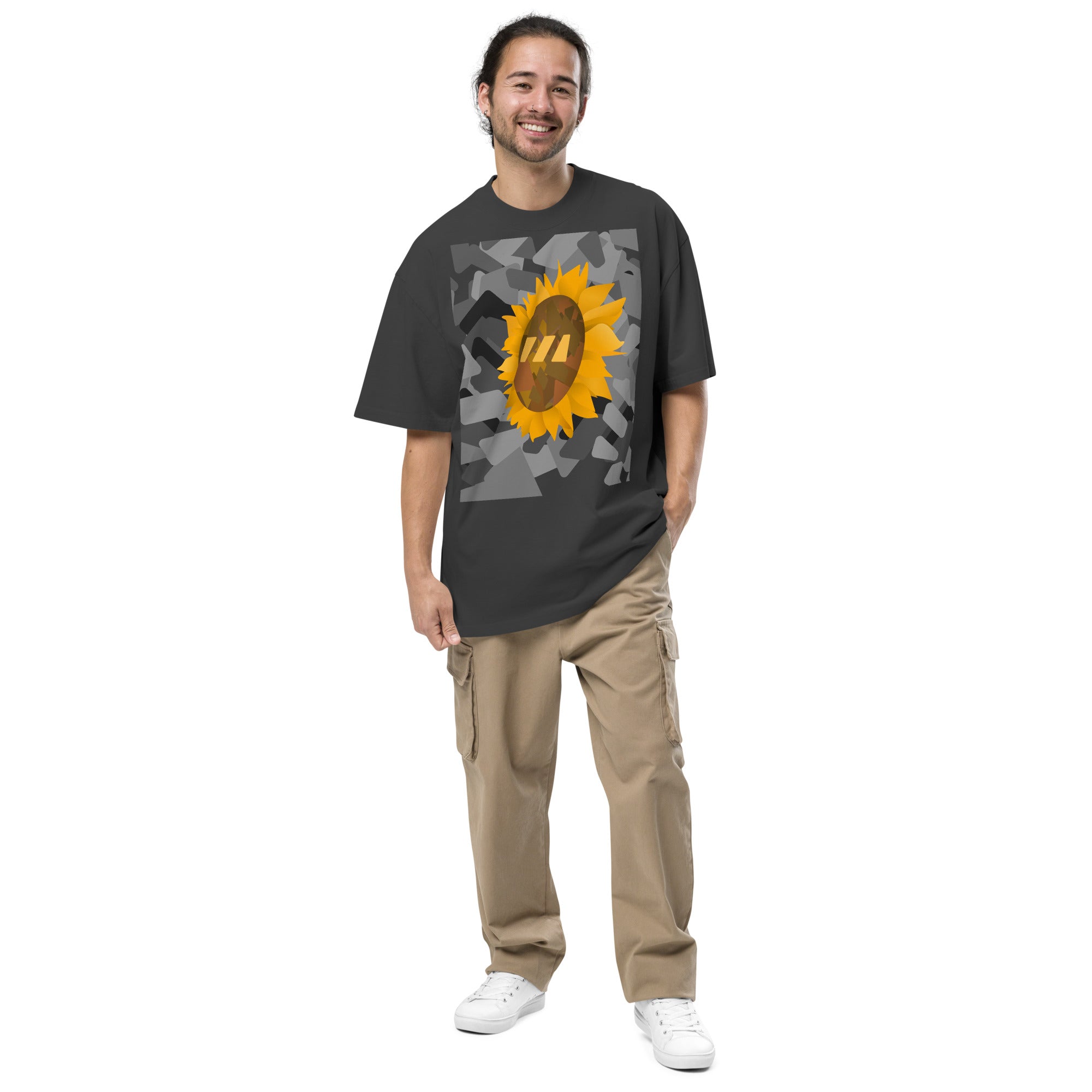 Man wearing the black Sun Flower brekky tshirt. Black t-shirt with a sunflower graphic set on an urban graphic made out of wedges. (Which is what the Brekky logo looks like) PS, he looks really cool.