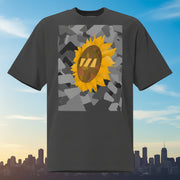 Black t-shirt with a sunflower graphic set on an urban graphic made out of black-and-white wedges. (Which is what the Brekky logo looks like)