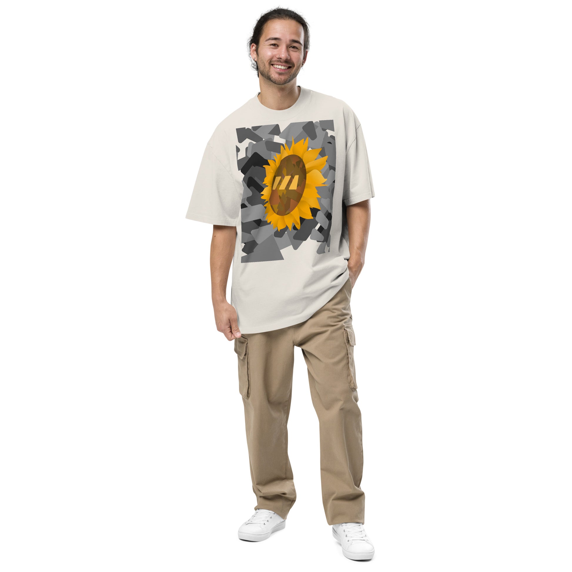 Man wearing the faded bone, Sun Flower brekky tshirt. Faded bone, or off-white, t-shirt with a sunflower graphic set on an urban black-and-white graphic made out of wedges. (Which is what the Brekky logo looks like) PS, he looks really cool.