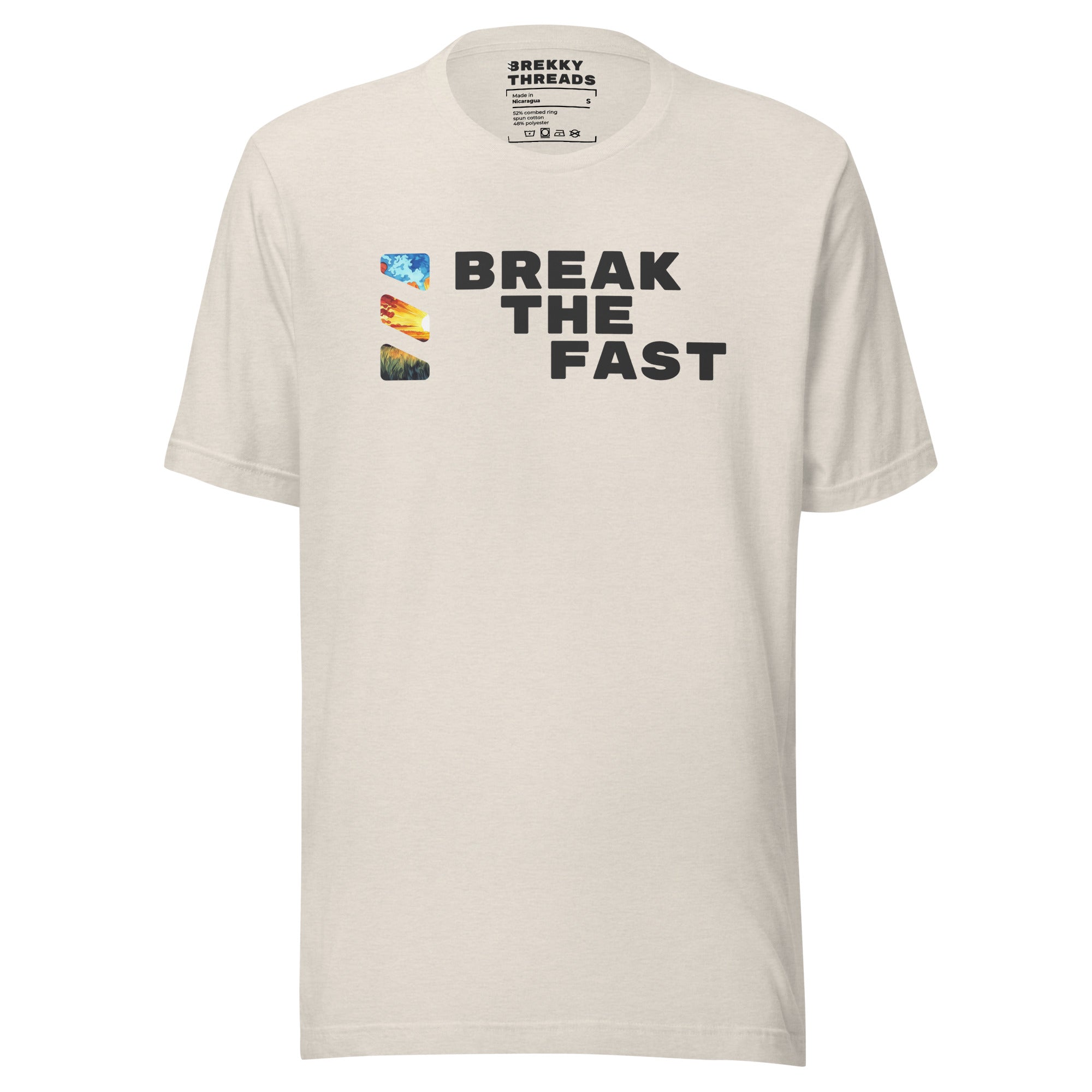 Graphic Tshirt with the comedic saying "Break The Fast" printed on the front with a diagonal stance, going from the top left to the bottom right. The Brekky Threads logo is printed vertically to the left of the text, masking an image of a sunrise. Staple tshirt, comfortable slim fit. Printed label with Company logo inside the colar. Unisex. Color: Heather Dust (Beige).
